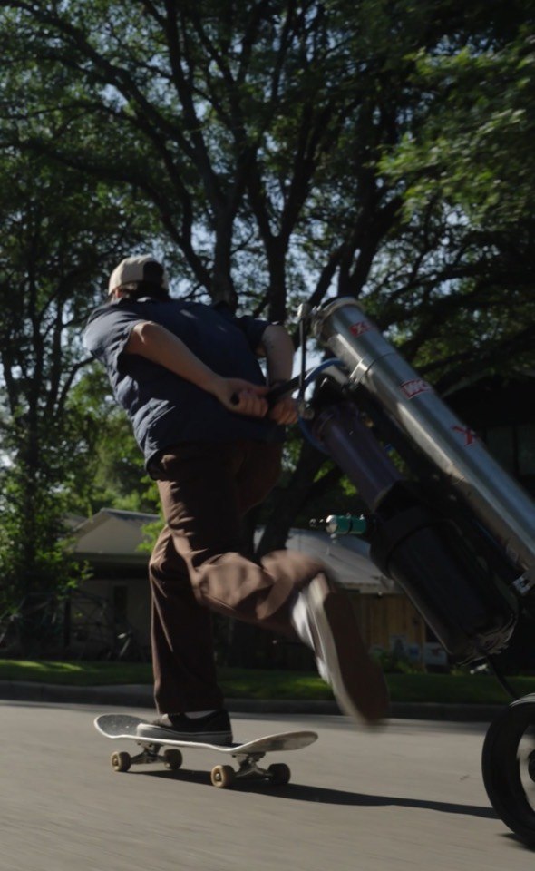 Giant Window Cleaning technician moving water-fed pole equipment through an Austin neighborhood